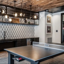 Challenge your neighbors to a friendly match at the ping pong table! clubhouse with a ping pong table