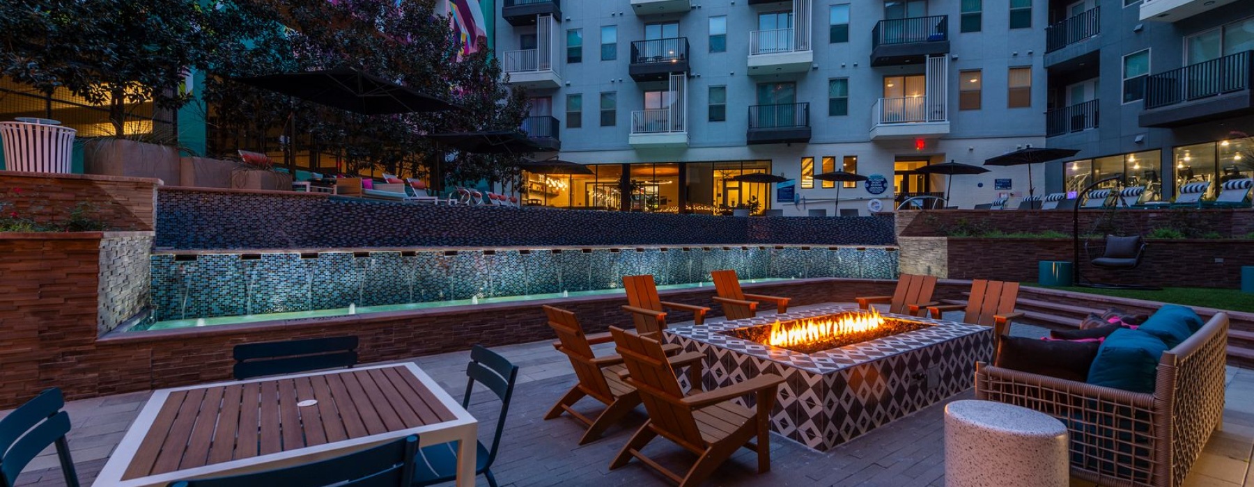 Outdoor grill and lounge area with a fire pit