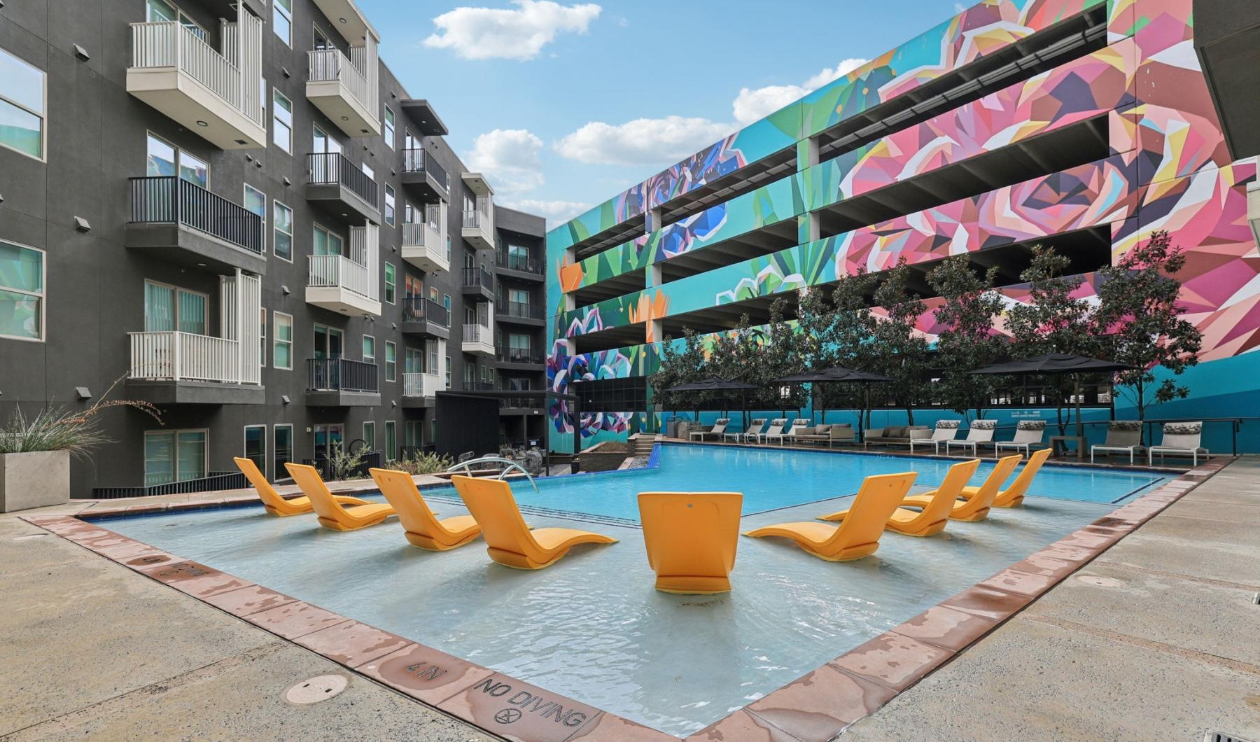 Find your perfect fit at Atlas North Lamar a row of yellow and blue chairs on a sidewalk