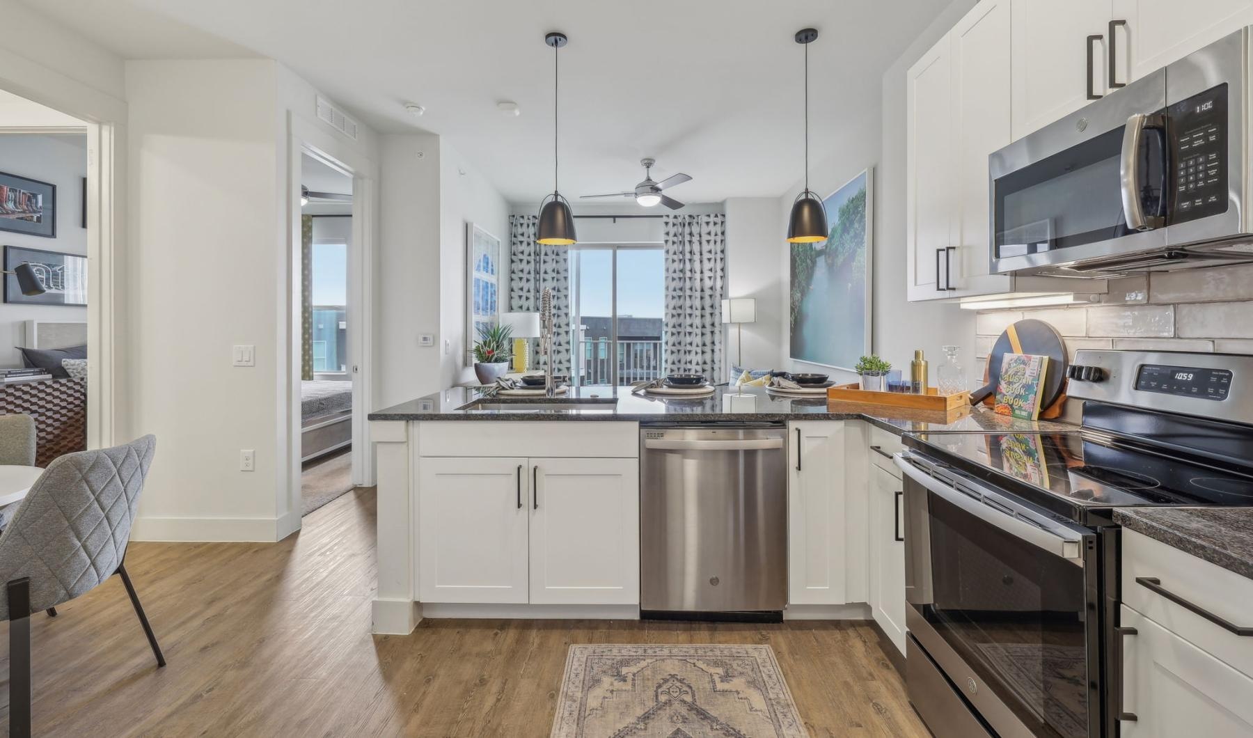 Find your perfect fit at Atlas North Lamar a kitchen with white cabinets